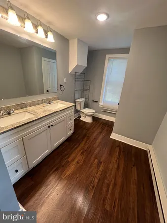 a bathroom with a sink and a large mirror