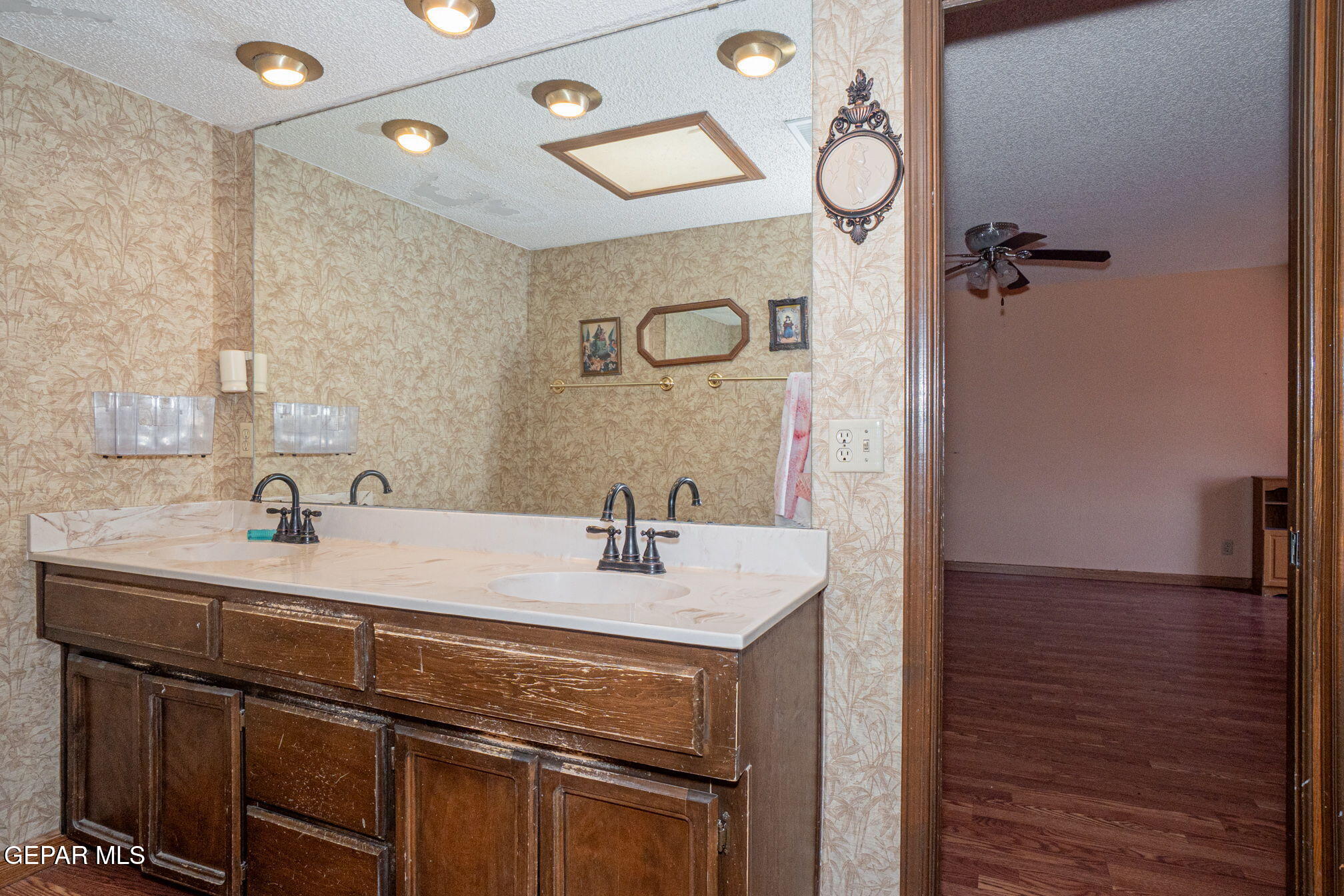 4643 R L Shoemaker Drive El Paso, TX 79924 - Photo 11 of 24 a bathroom with a sink vanity granite and a mirror