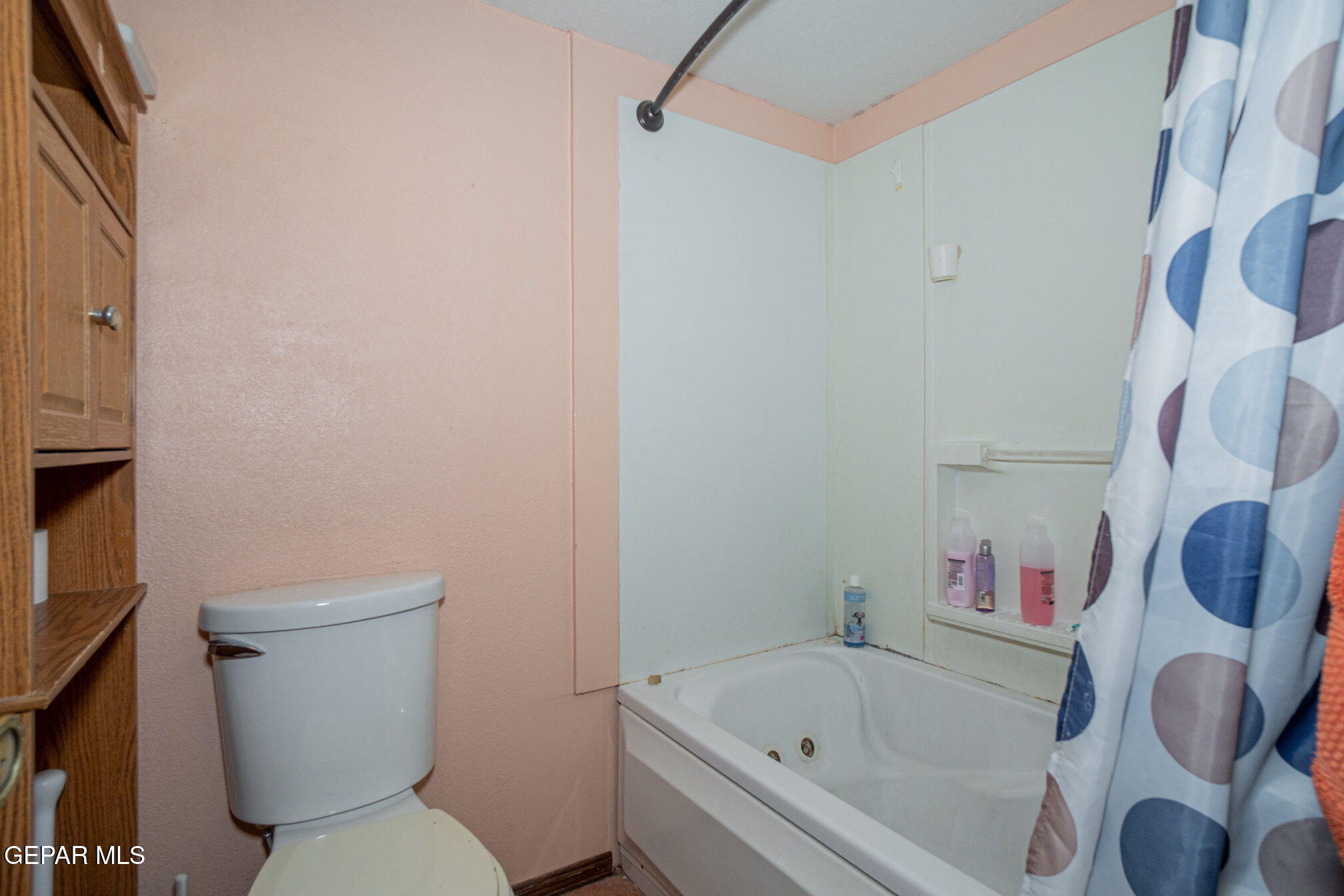 4643 R L Shoemaker Drive El Paso, TX 79924 - Photo 12 of 24 a white toilet sitting next to a bath tub