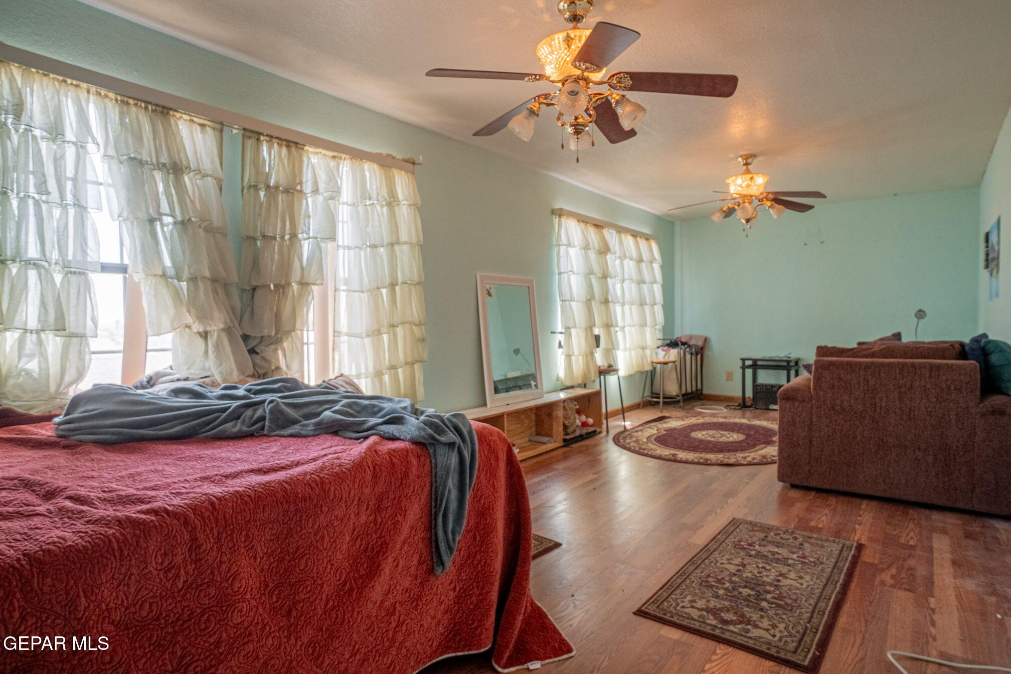 4643 R L Shoemaker Drive El Paso, TX 79924 - Photo 13 of 24 a bedroom with a large bed and a window