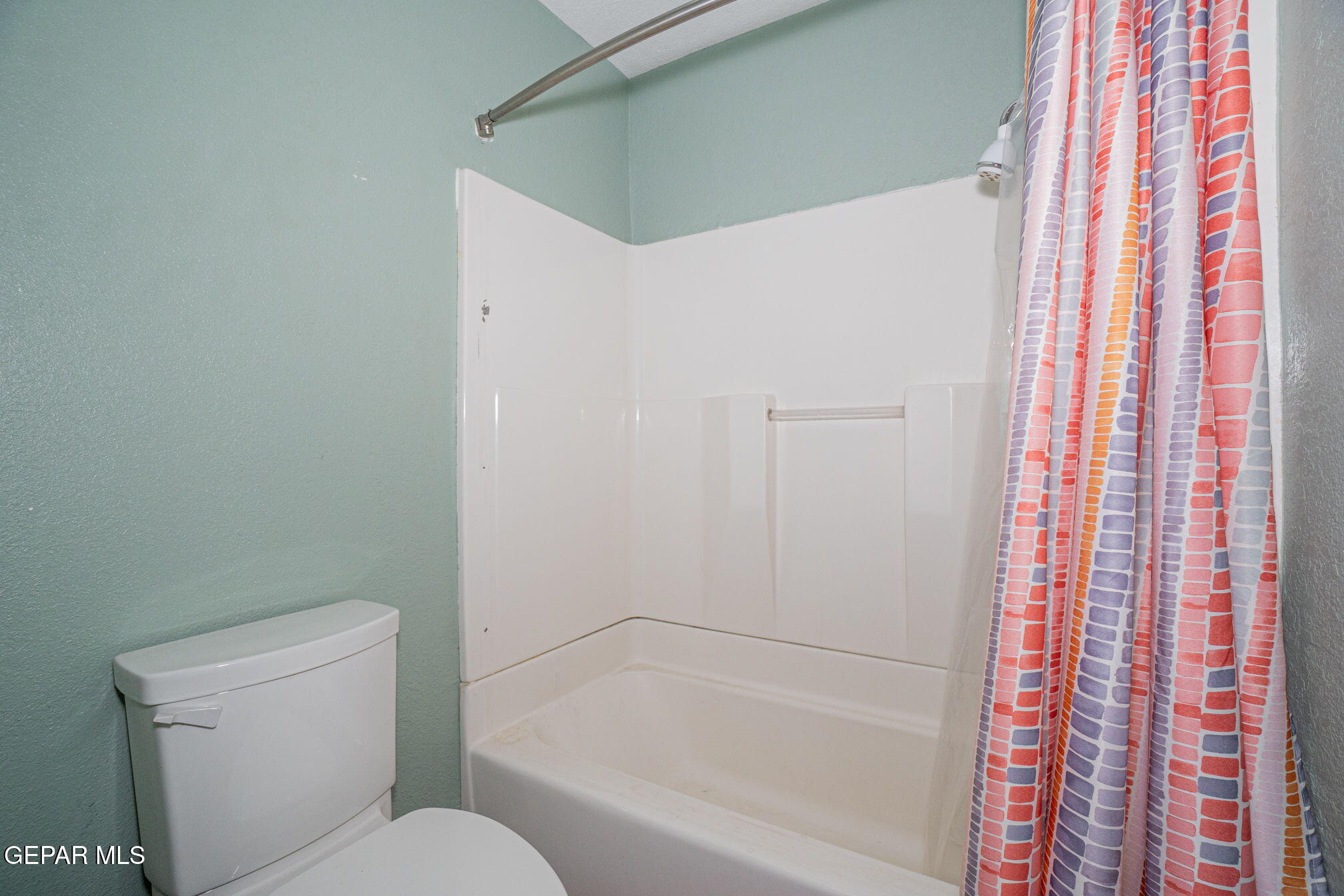 4643 R L Shoemaker Drive El Paso, TX 79924 - Photo 16 of 24 a white toilet sitting next to a bath tub