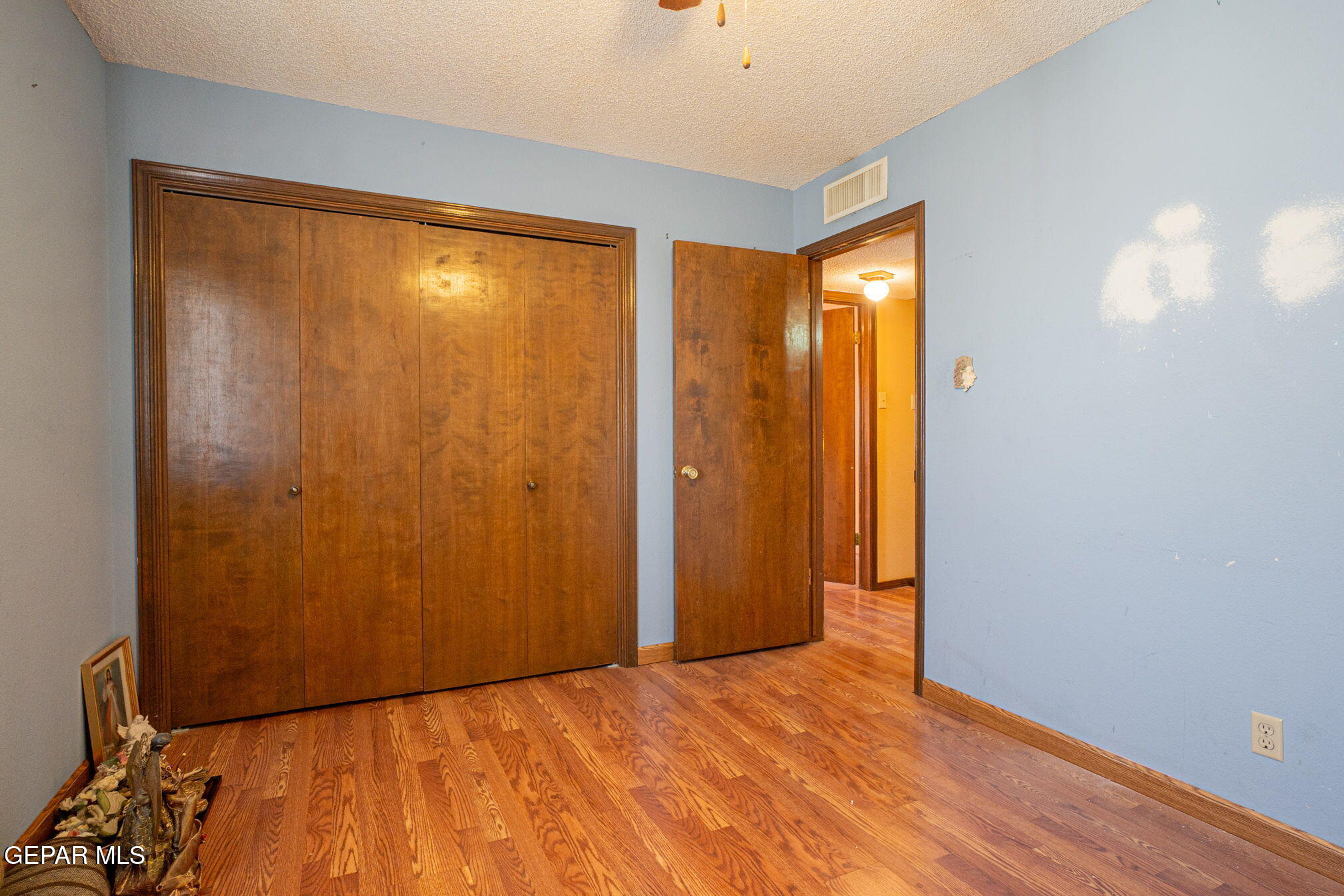 4643 R L Shoemaker Drive El Paso, TX 79924 - Photo 17 of 24 a view of an empty room with wooden floor and a window