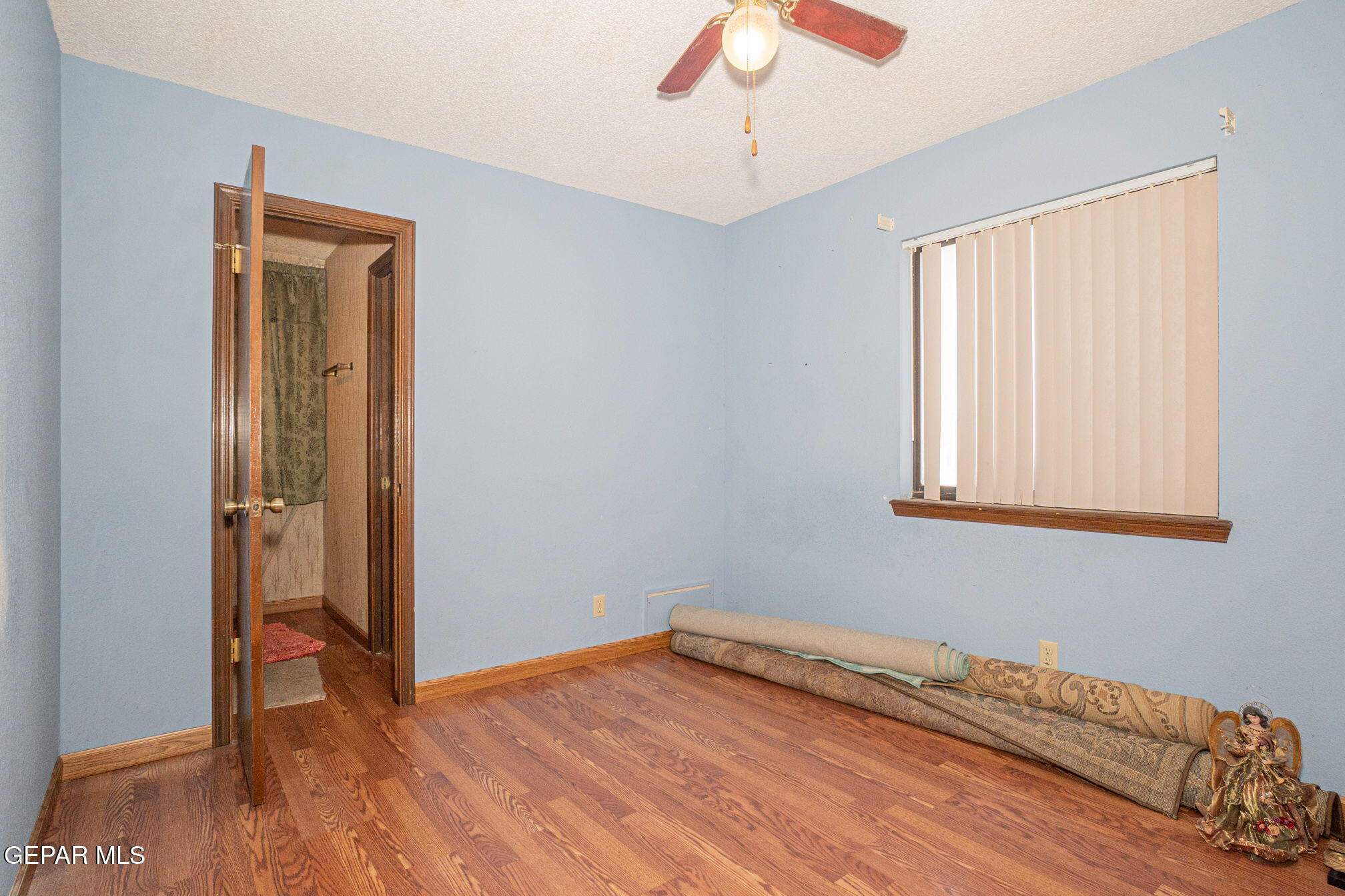 4643 R L Shoemaker Drive El Paso, TX 79924 - Photo 18 of 24 a view of empty room with wooden floor and fan