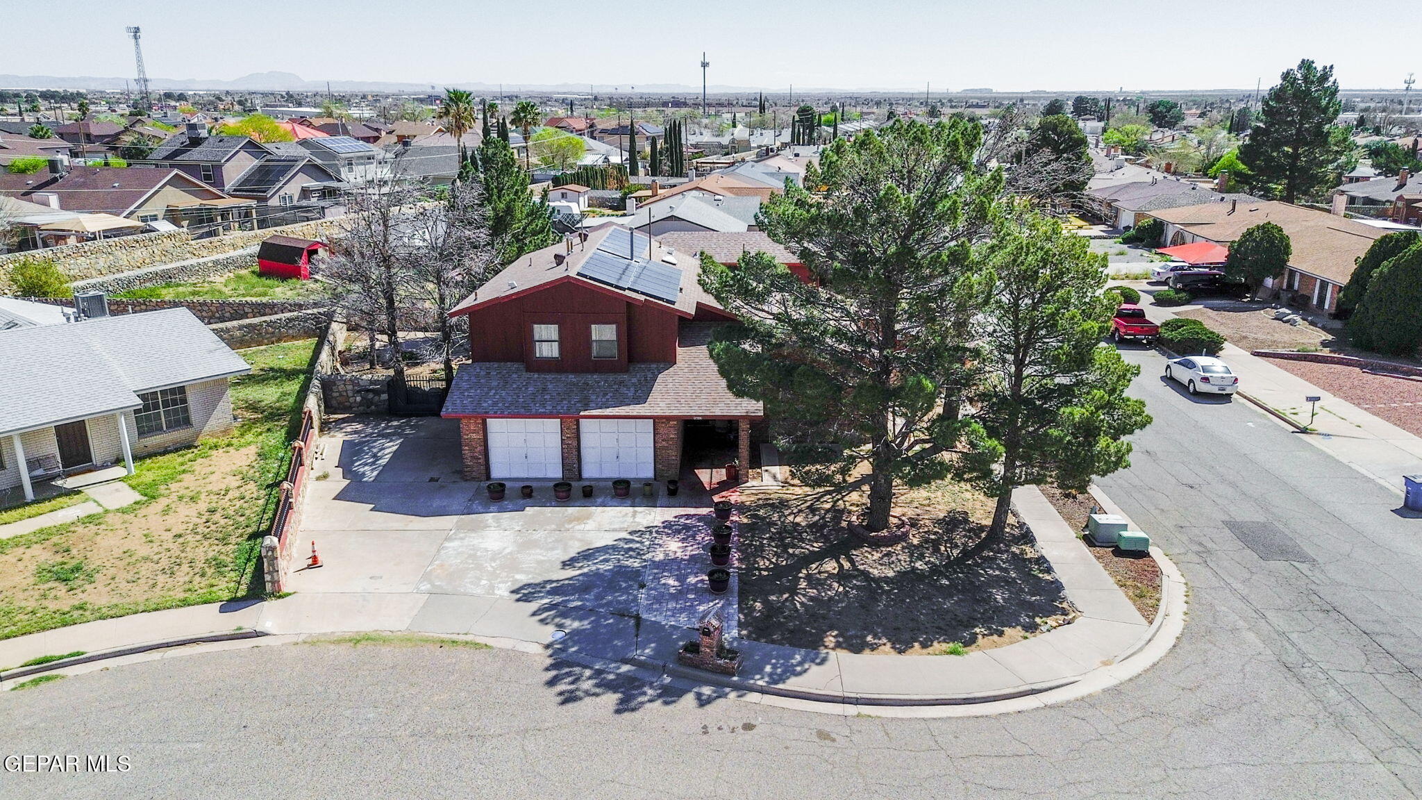 4643 R L Shoemaker Drive El Paso, TX 79924 - Photo 22 of 24 a view of a house with a yard and garage