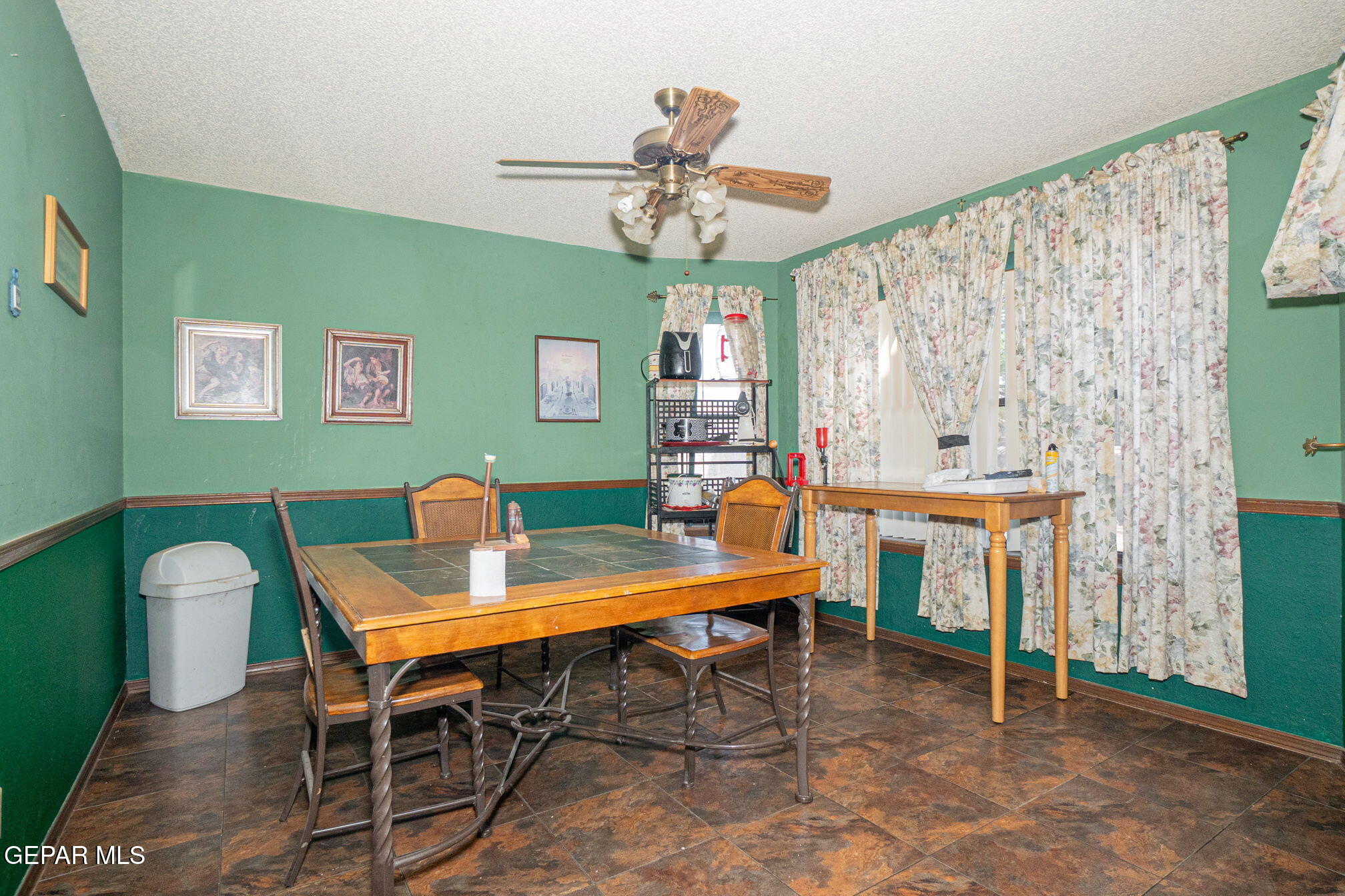 4643 R L Shoemaker Drive El Paso, TX 79924 - Photo 7 of 24 a view of a dining room with furniture window and wooden floor