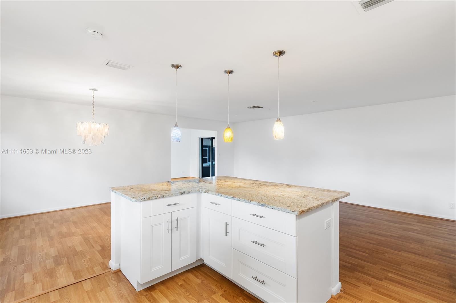 6240 Dusenburg Road Delray Beach, FL 33484 - Photo 11 of 25 a view white cabinets and wooden floor