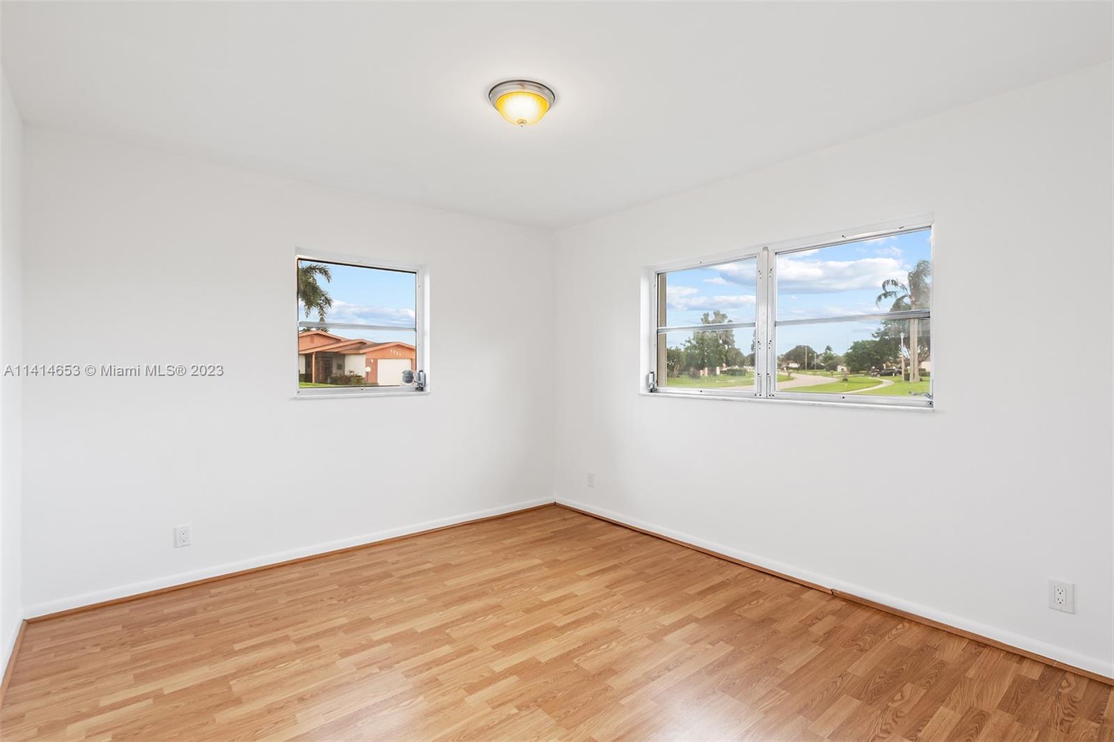 6240 Dusenburg Road Delray Beach, FL 33484 - Photo 16 of 25 an empty room with a painting on the wall