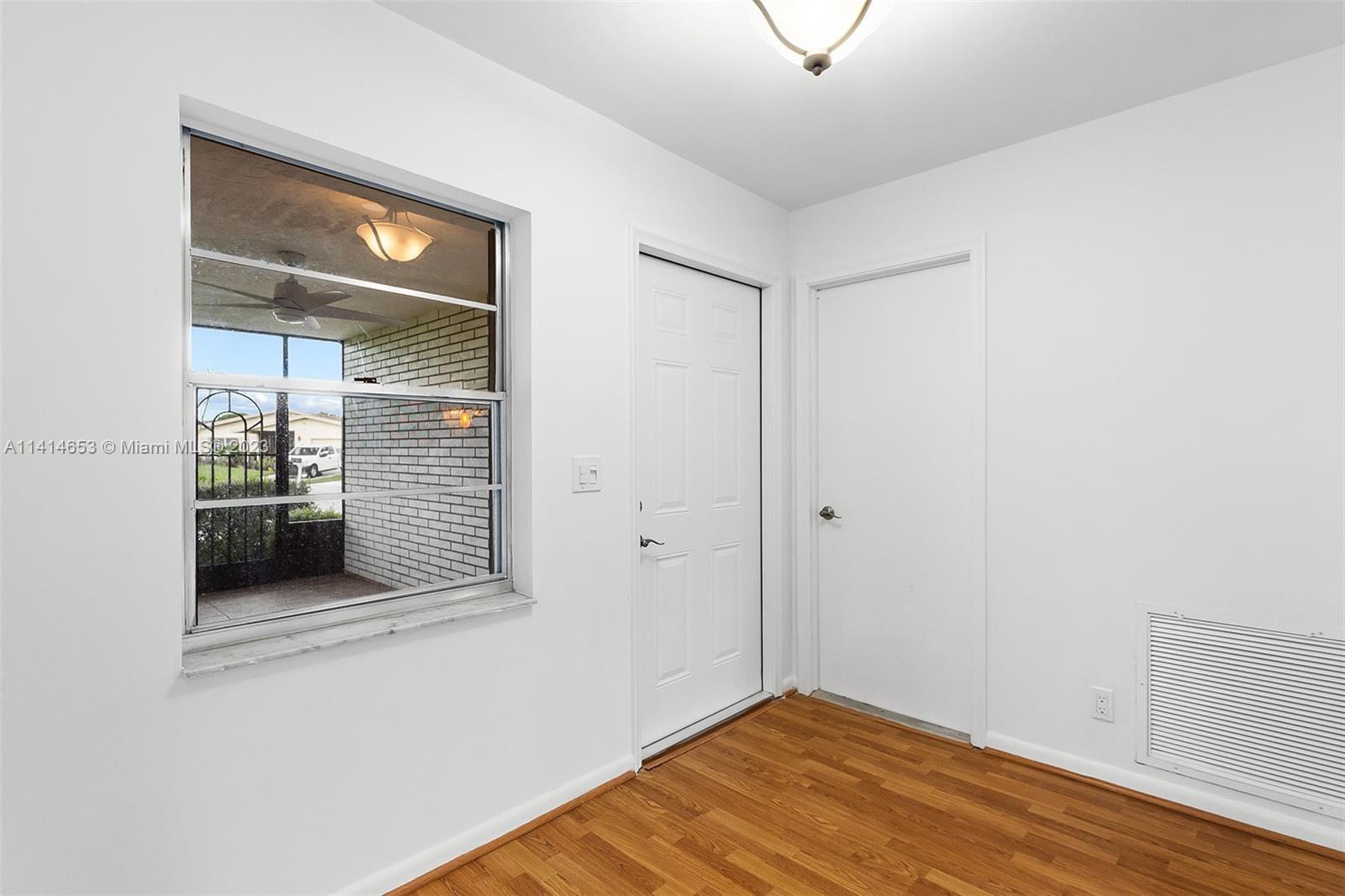 6240 Dusenburg Road Delray Beach, FL 33484 - Photo 20 of 25 a view of a hallway with wooden floor and closet