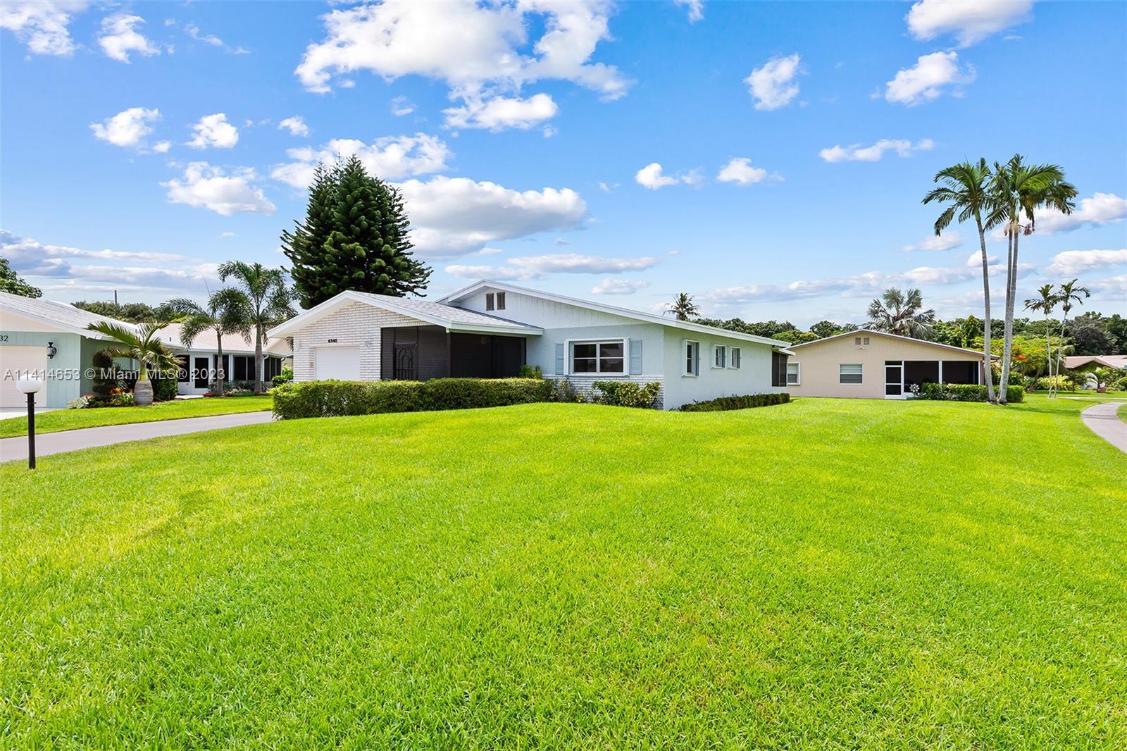 6240 Dusenburg Road Delray Beach, FL 33484 - Photo 2 of 25 a view of a house with a big yard