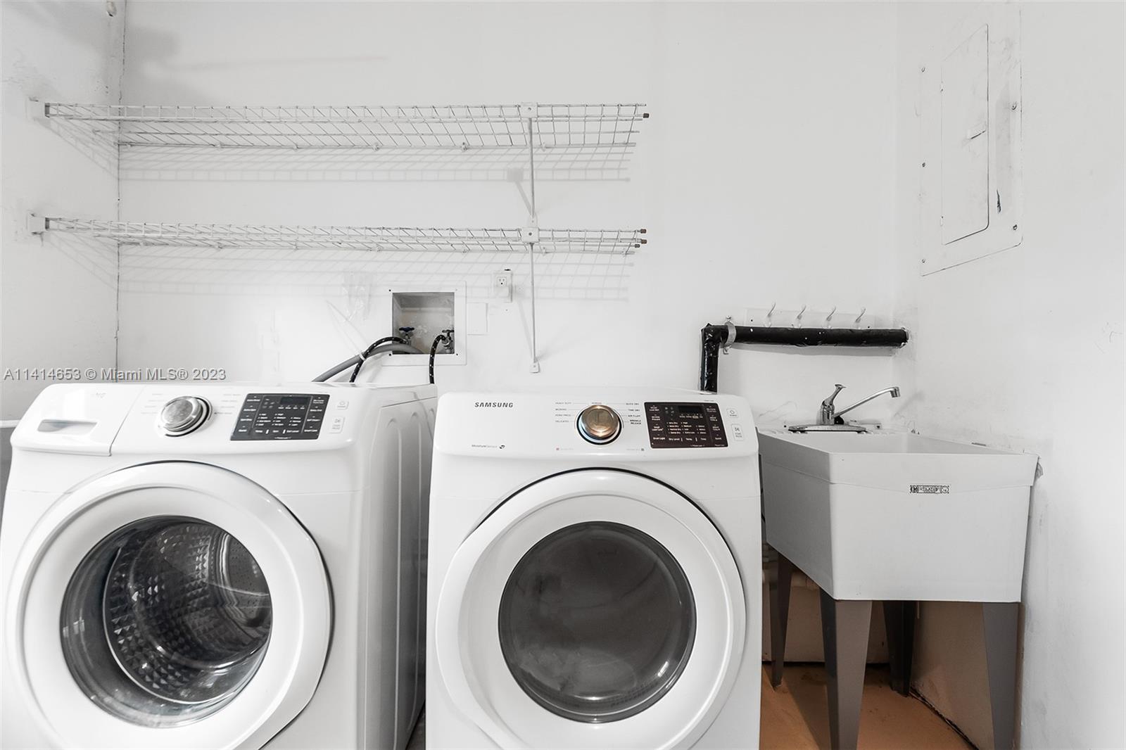 6240 Dusenburg Road Delray Beach, FL 33484 - Photo 21 of 25 a utility room with dryer and washer
