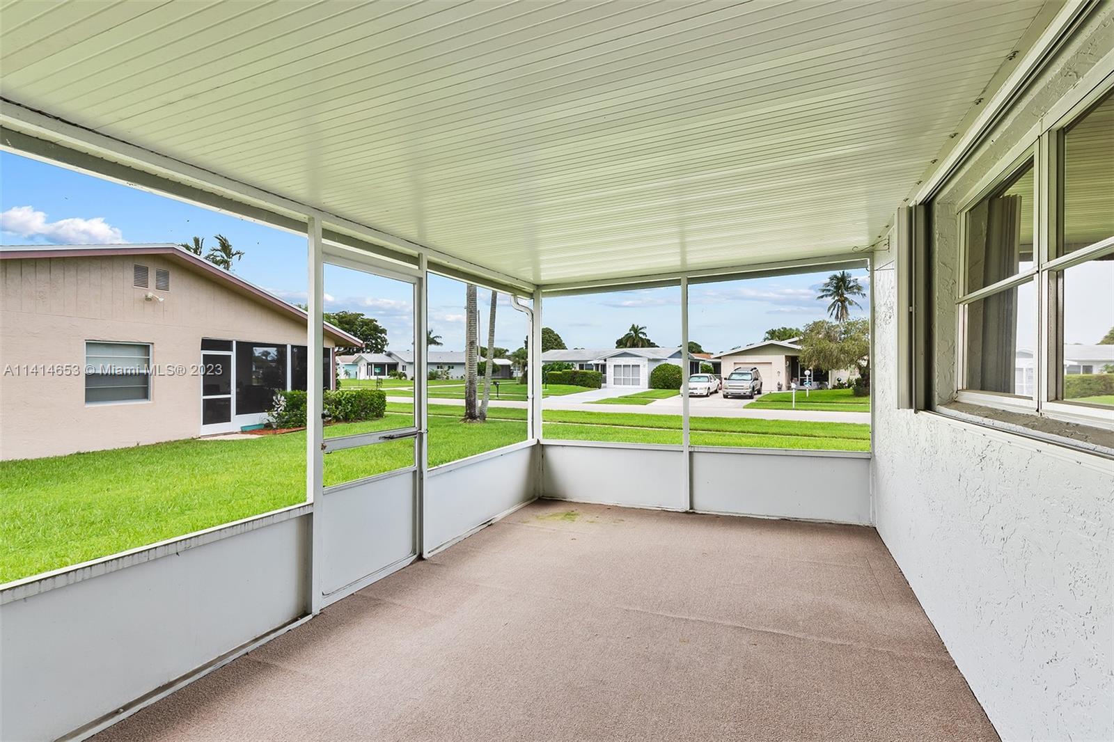 6240 Dusenburg Road Delray Beach, FL 33484 - Photo 22 of 25 a view of a house with a swimming pool