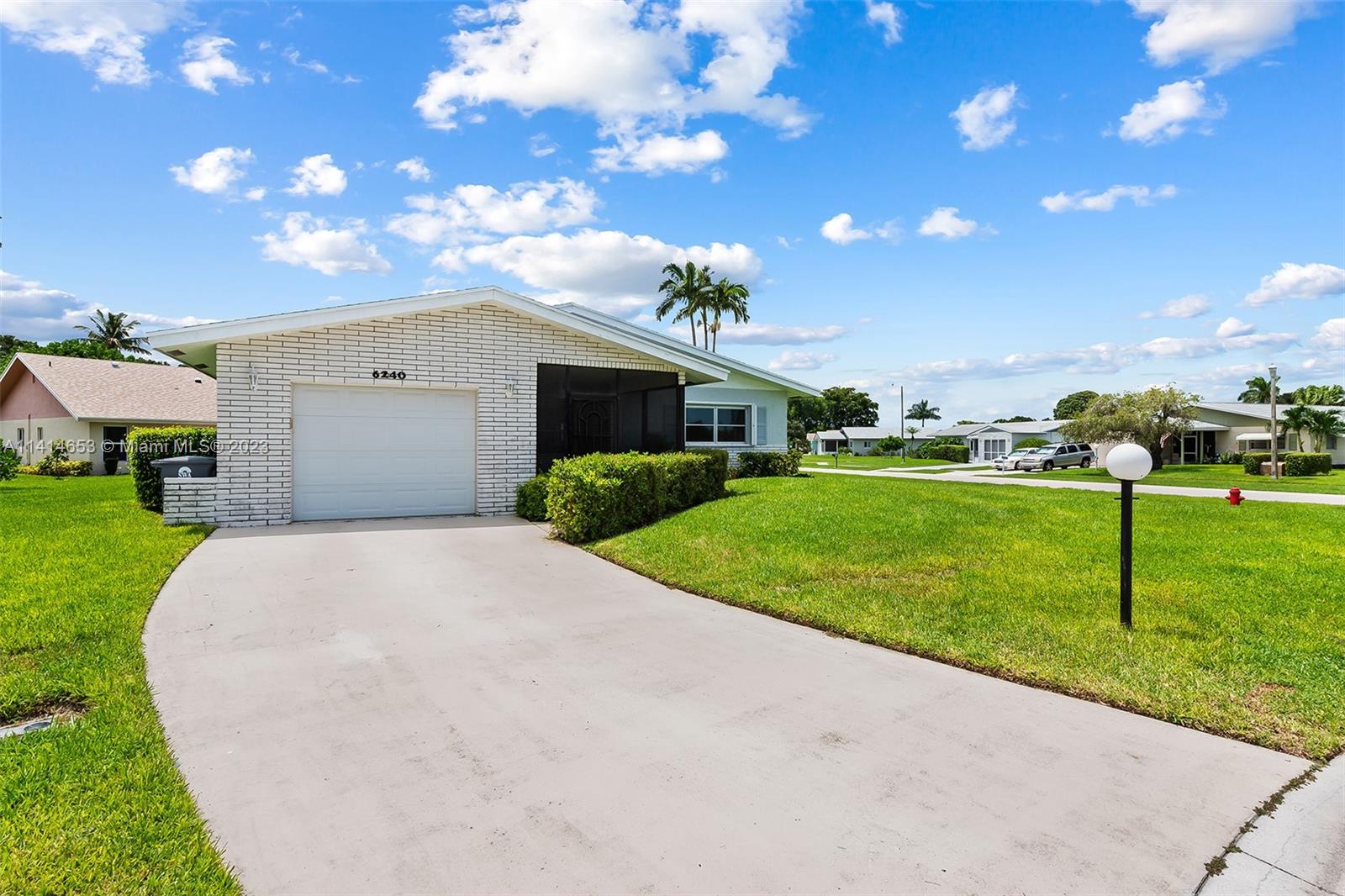 6240 Dusenburg Road Delray Beach, FL 33484 - Photo 3 of 25 a view of a house with a yard