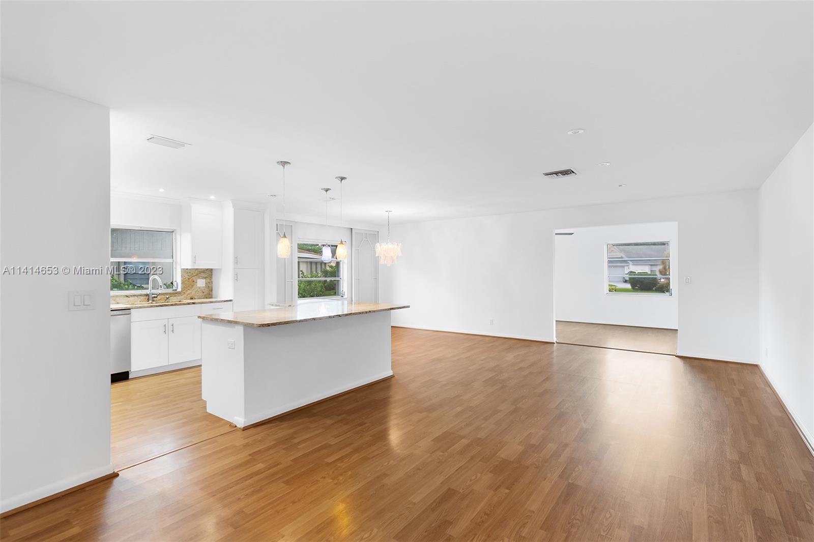 6240 Dusenburg Road Delray Beach, FL 33484 - Photo 7 of 25 a view of kitchen with wooden floor and electronic appliances
