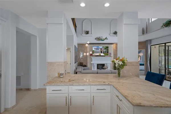 a bathroom with a tub shower vanity and a sink