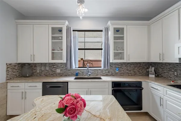 a spacious bathroom with a vanity and a sink