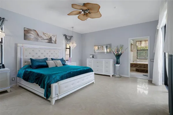 a bedroom with furniture and a window