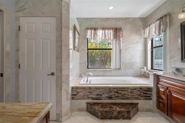 a bathroom with a shower and a sink