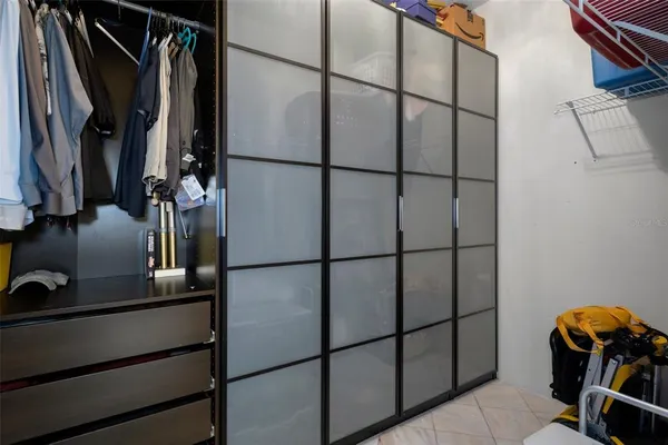 an empty room with windows and closet