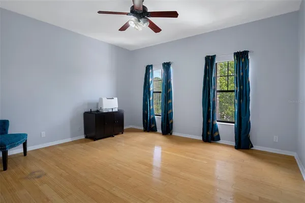 a bed sitting in a bedroom next to a window