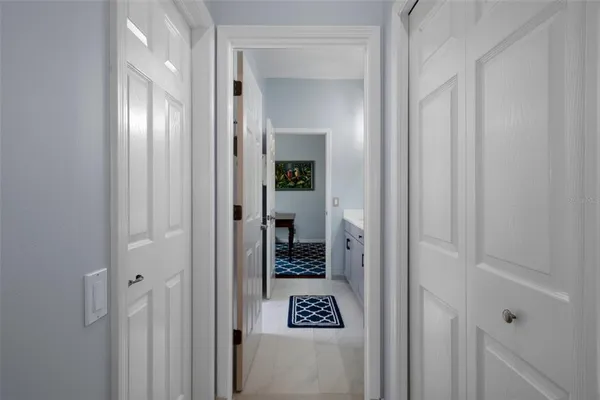 a view of living room filled with furniture and a rug