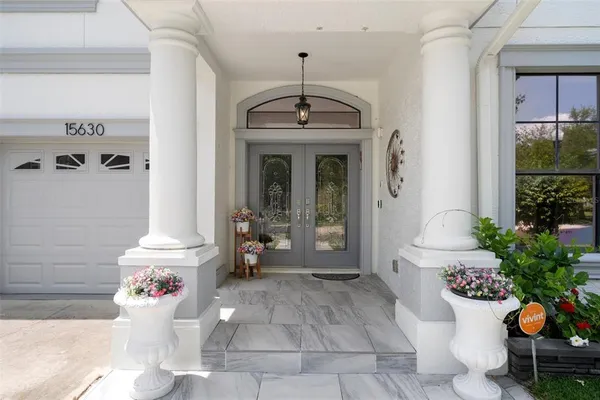 a kitchen with a stove sink and cabinets