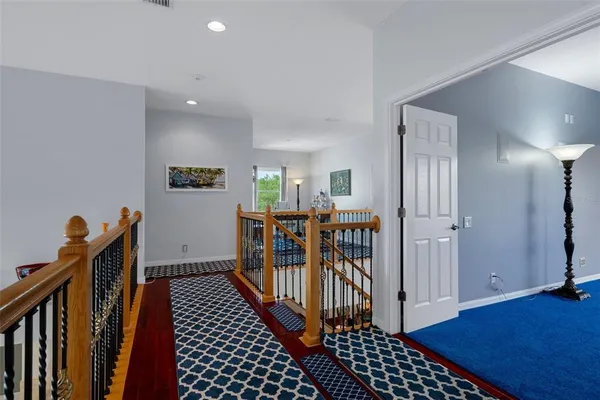 an aerial view of a house with a yard basket ball court and outdoor seating