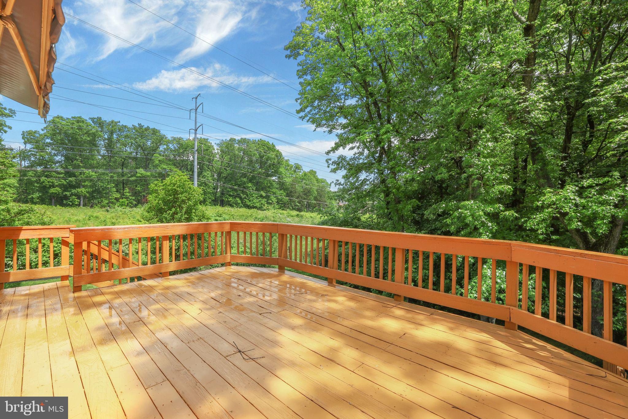 7760 Euclid Way Springfield, VA 22153 - Photo 16 of 50 a view of a balcony with wooden floor and fence