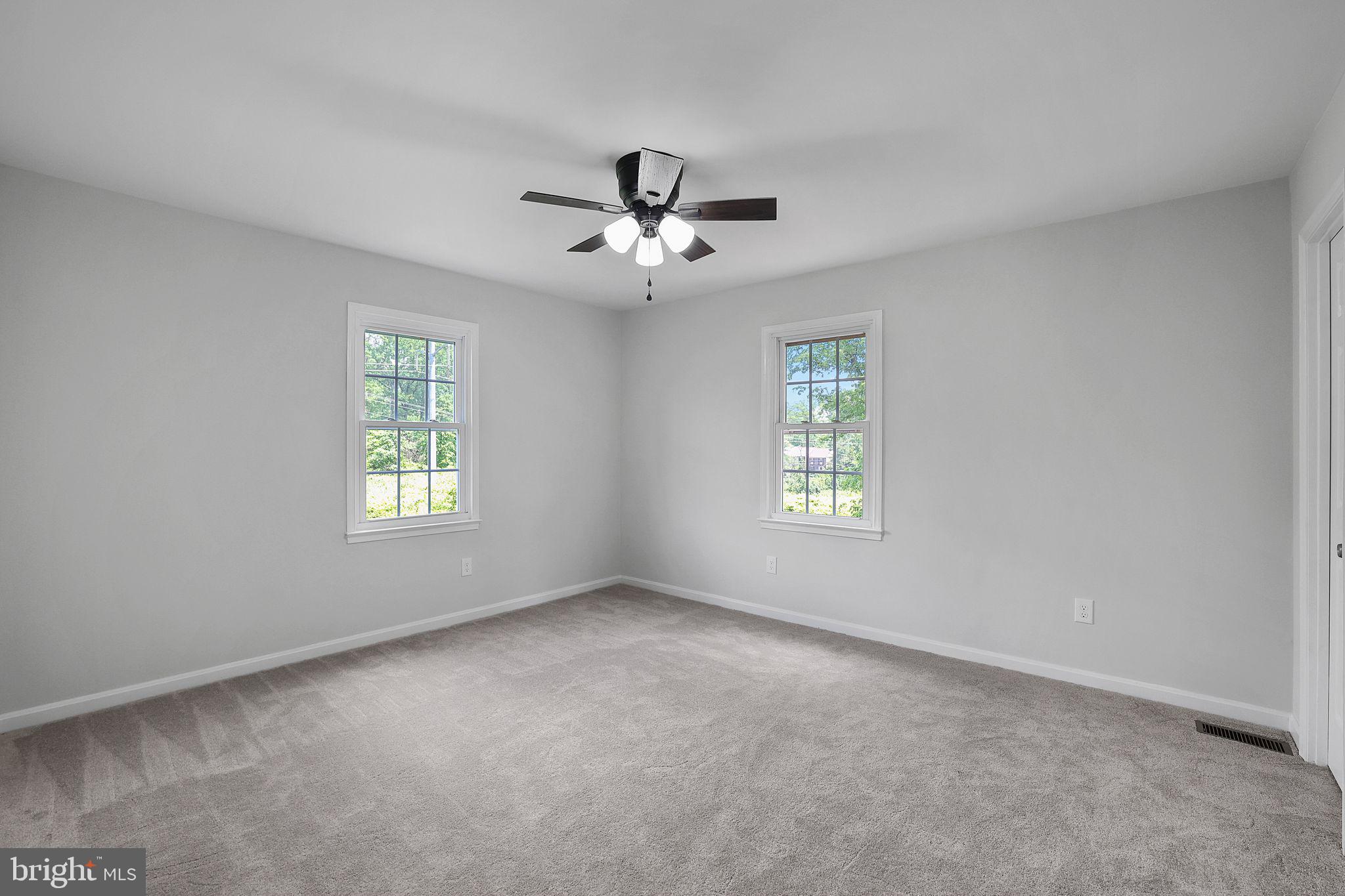 7760 Euclid Way Springfield, VA 22153 - Photo 19 of 50 a view of room with a ceiling fan and windows