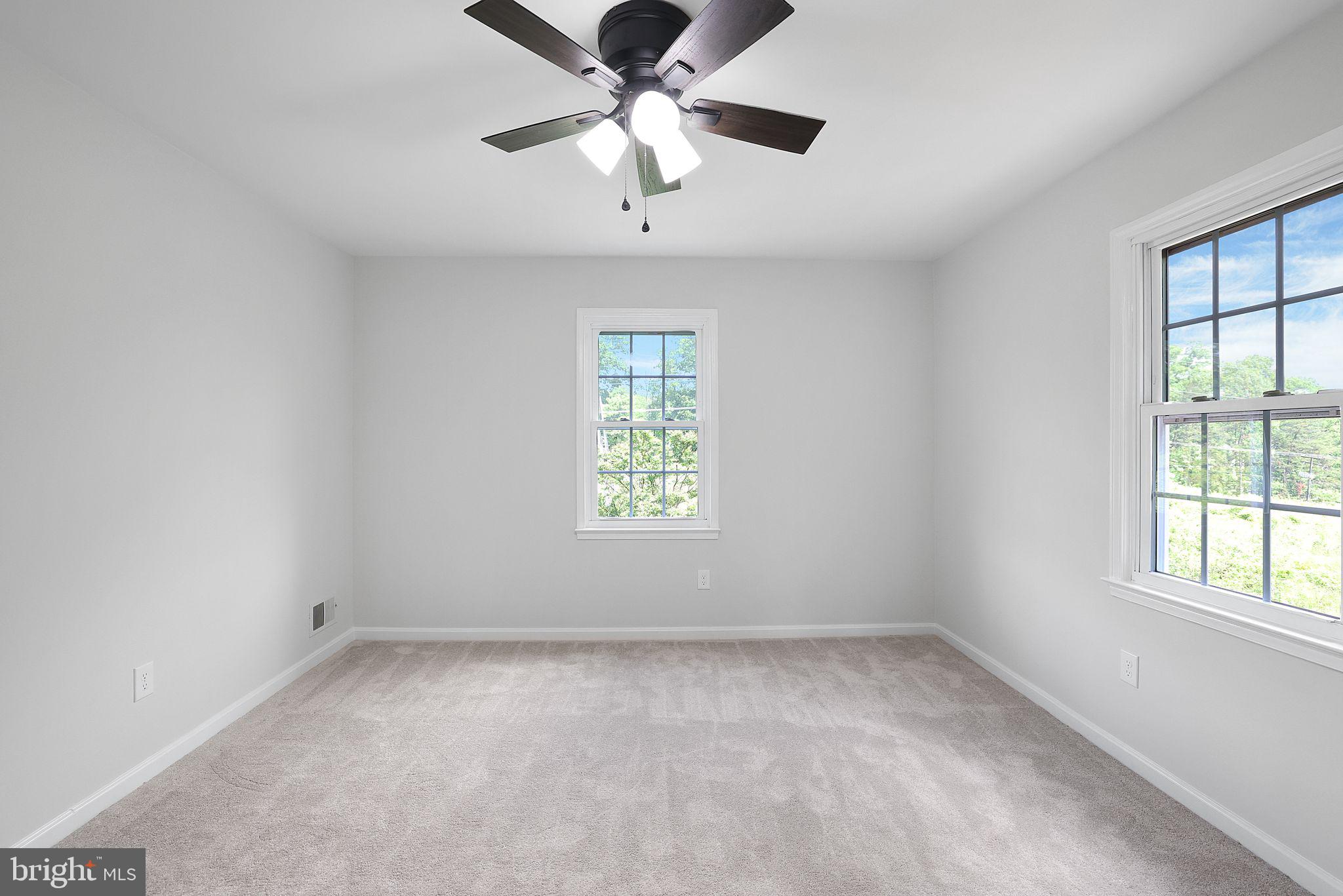 7760 Euclid Way Springfield, VA 22153 - Photo 23 of 50 an empty room with a window and a fan
