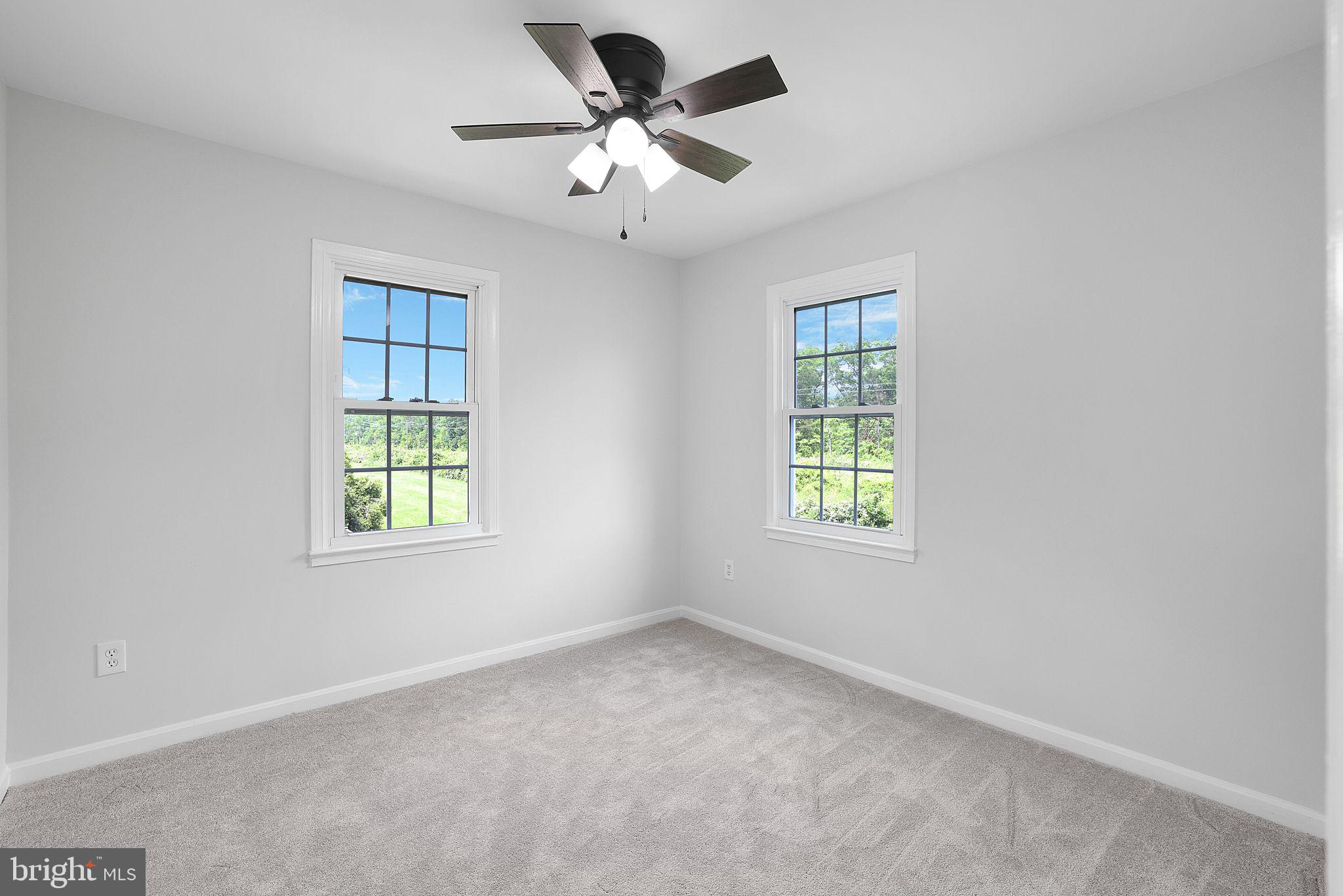 7760 Euclid Way Springfield, VA 22153 - Photo 29 of 50 an empty room with a window and a fan