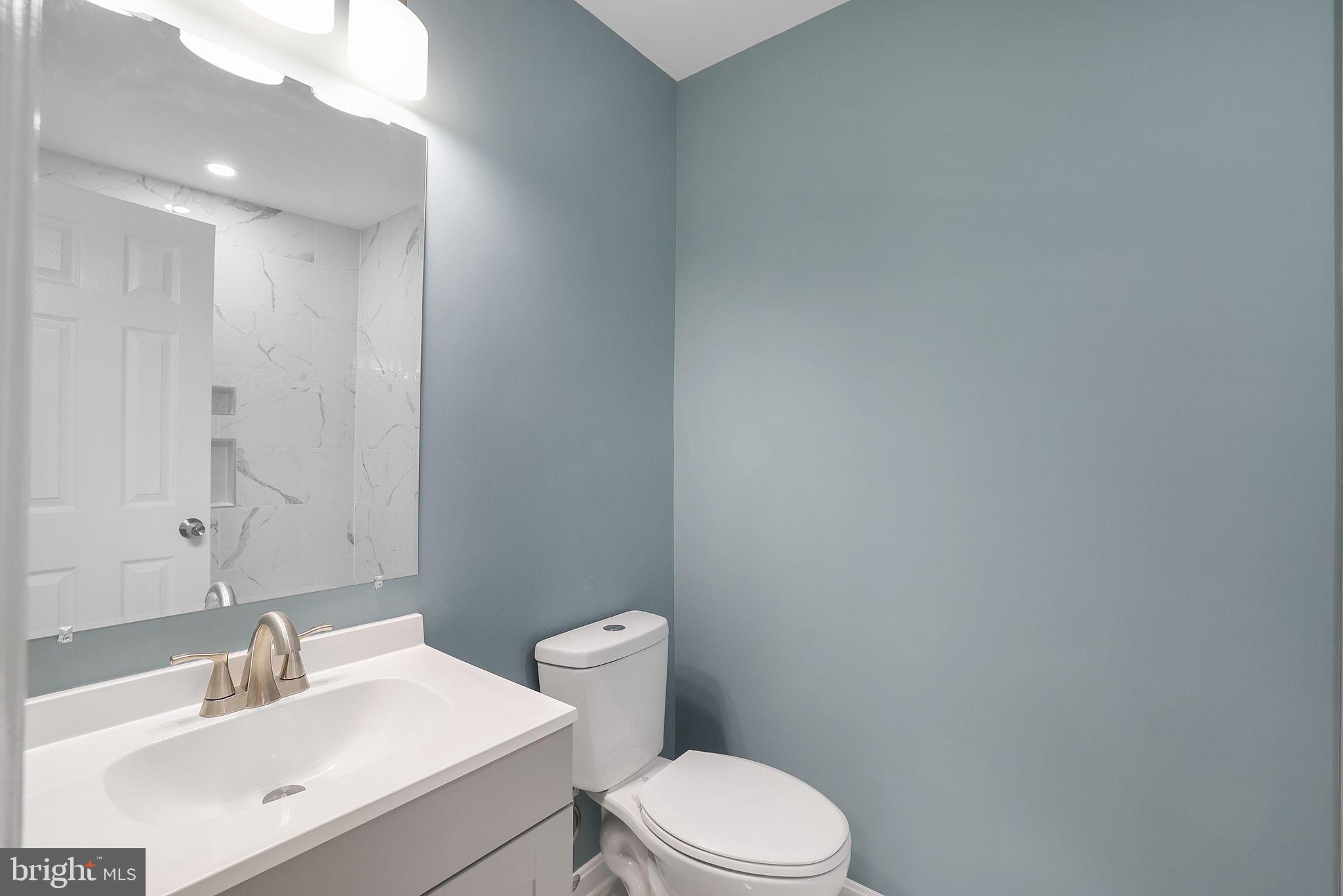 7760 Euclid Way Springfield, VA 22153 - Photo 31 of 50 a bathroom with a sink a toilet and mirror