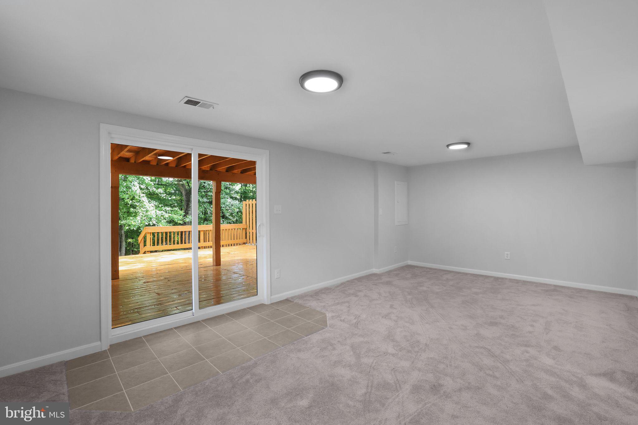 7760 Euclid Way Springfield, VA 22153 - Photo 35 of 50 an empty room with large window and outside view