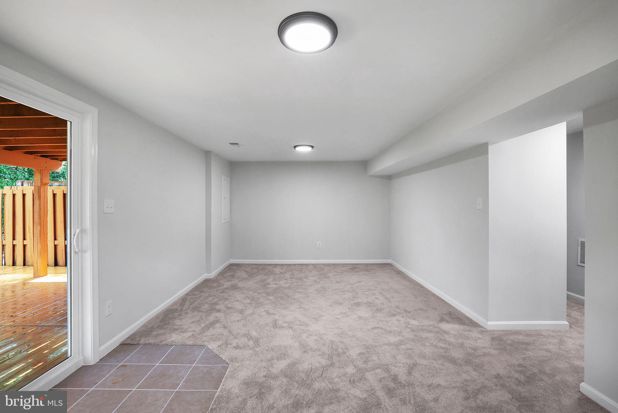 7760 Euclid Way Springfield, VA 22153 - Photo 38 of 50 an empty room with windows and entrance