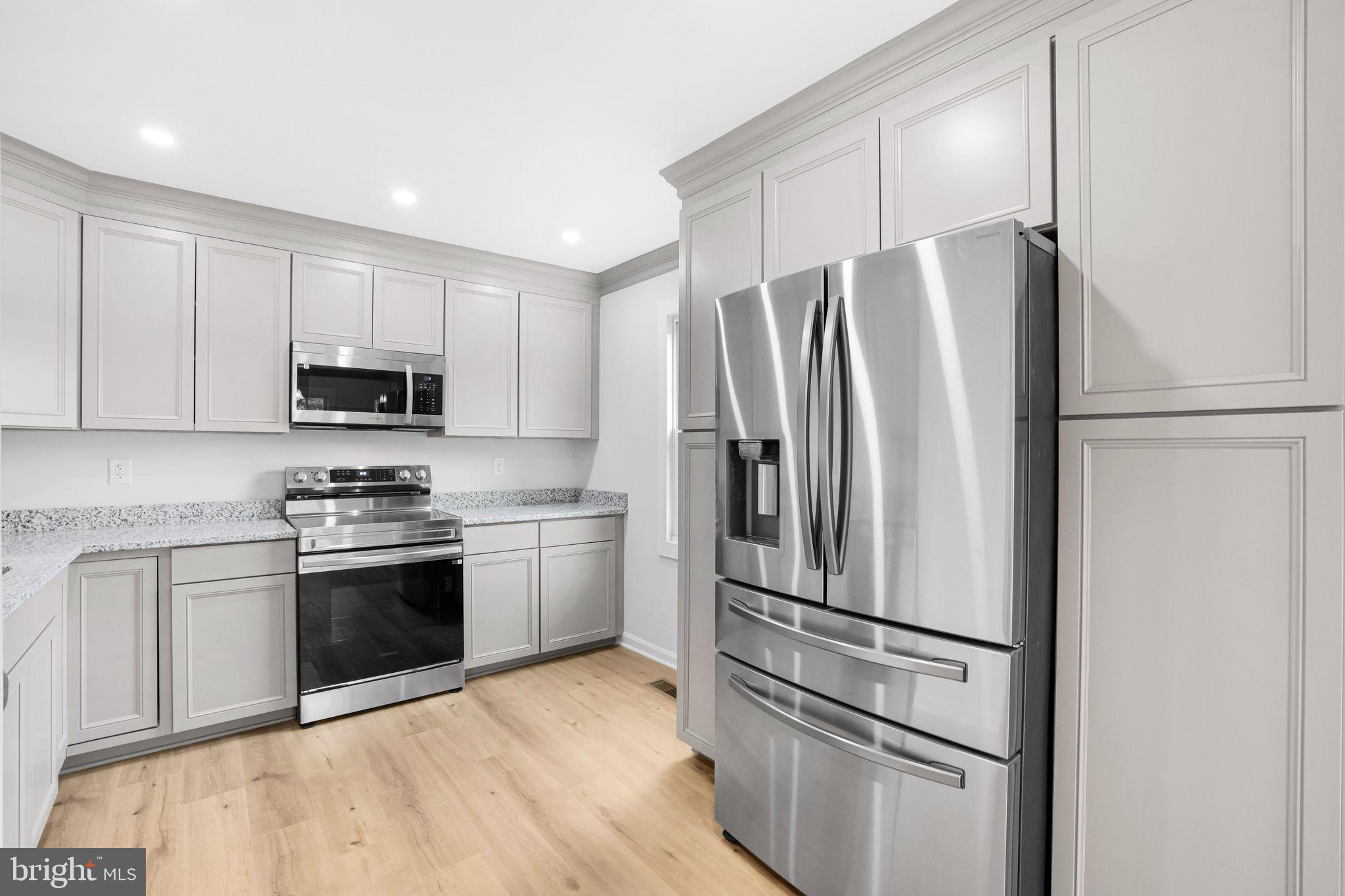 7760 Euclid Way Springfield, VA 22153 - Photo 4 of 50 a kitchen with stainless steel appliances granite countertop a refrigerator sink and stove