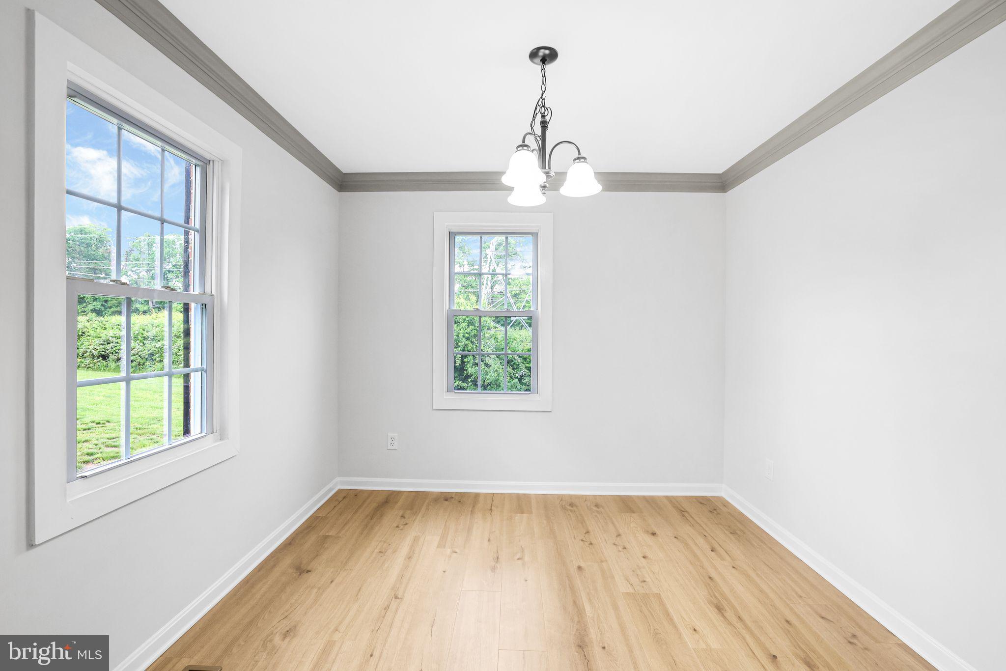 7760 Euclid Way Springfield, VA 22153 - Photo 8 of 50 a view of empty room with wooden floor and fan