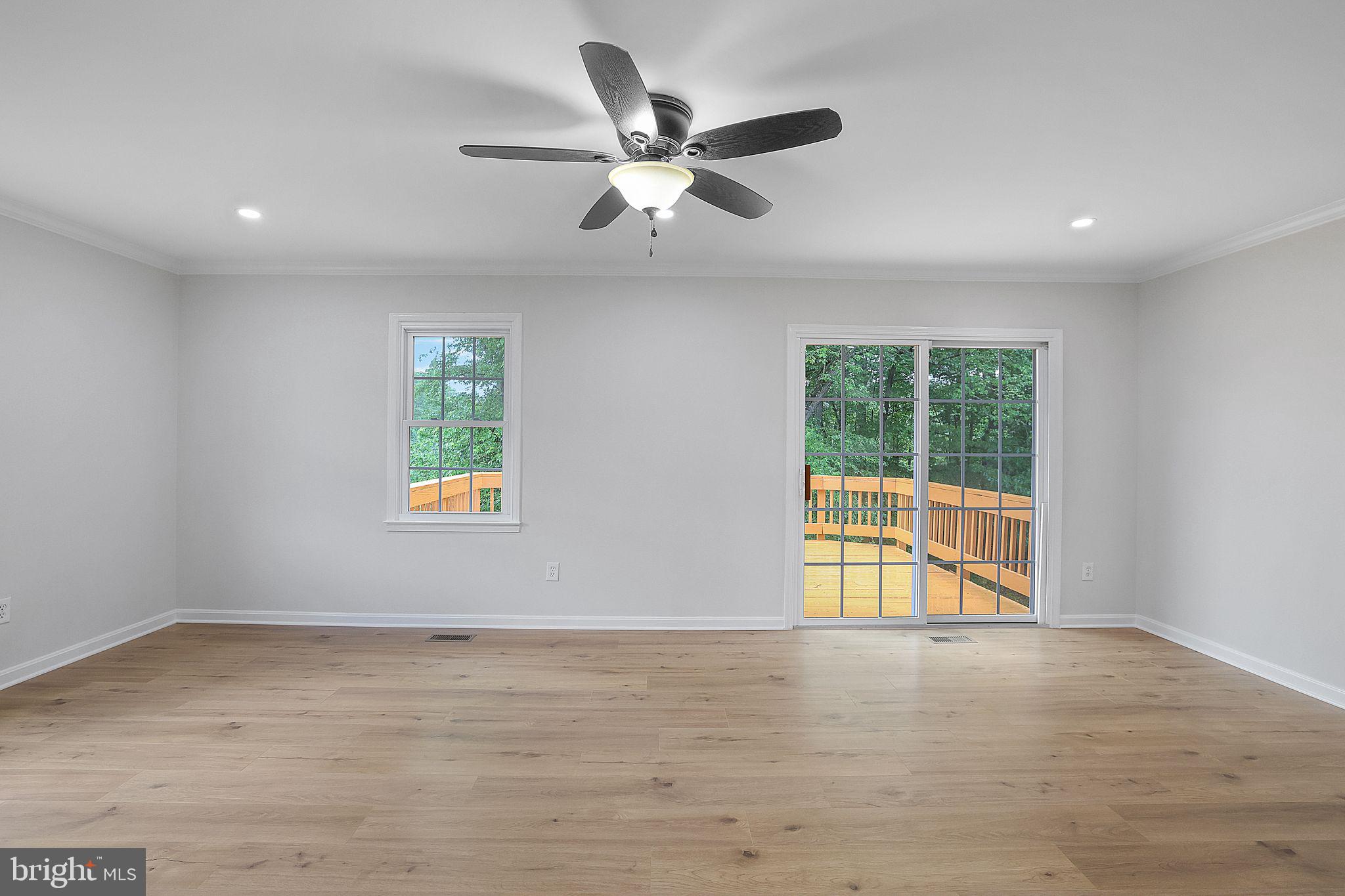 7760 Euclid Way Springfield, VA 22153 - Photo 10 of 50 an empty room with window and ceiling fan