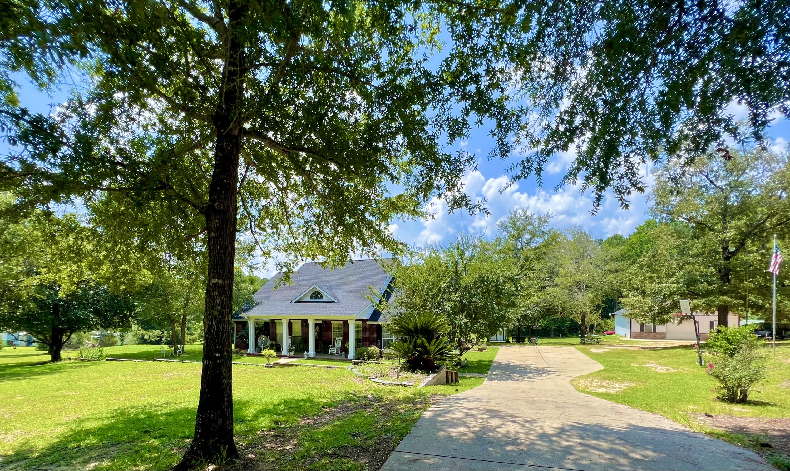 7698 4 Flags Road Laurel Hill, FL 32567 - Photo 1 of 69 A38C6893-6D33-4DD7-B7B9-81DBA457A804
