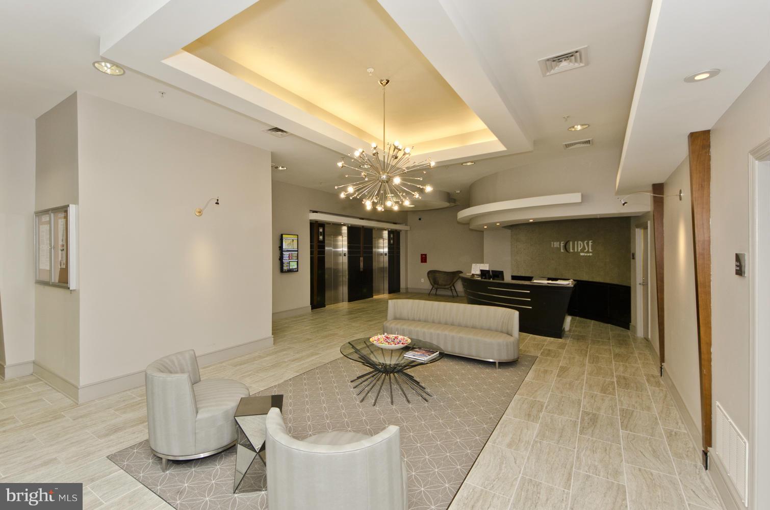3600 South Glebe Road, Unit 235W Arlington, VA 22202 - Photo 15 of 30 a dining room with furniture and chandelier