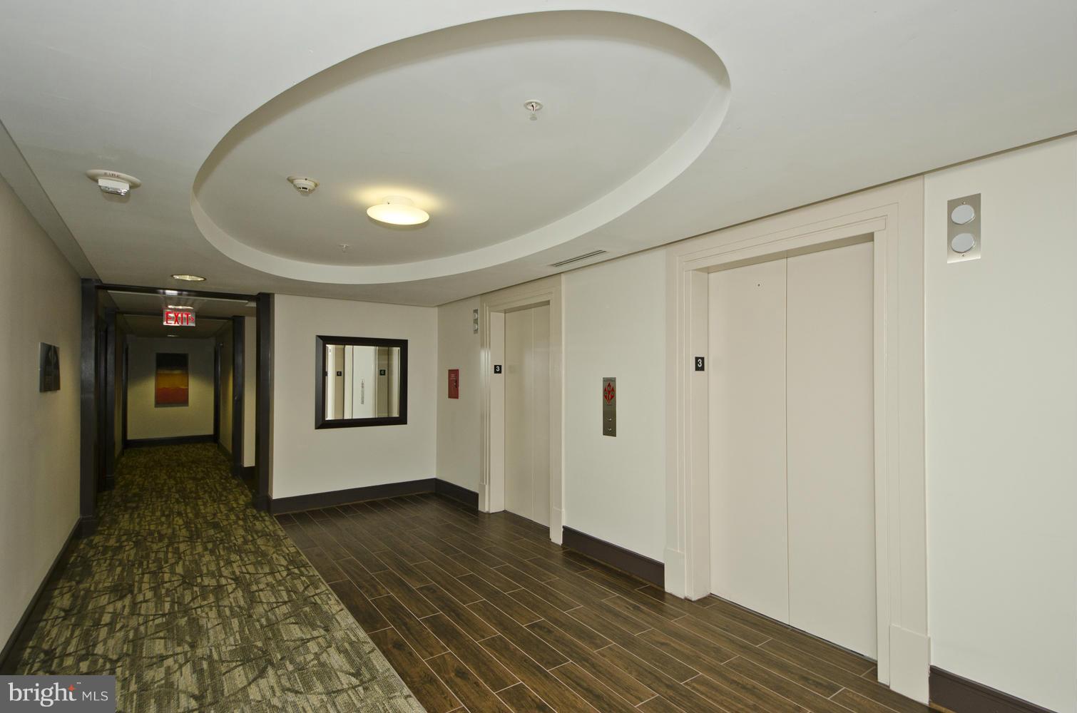 3600 South Glebe Road, Unit 235W Arlington, VA 22202 - Photo 16 of 30 a view of livingroom with hardwood floor and hallway
