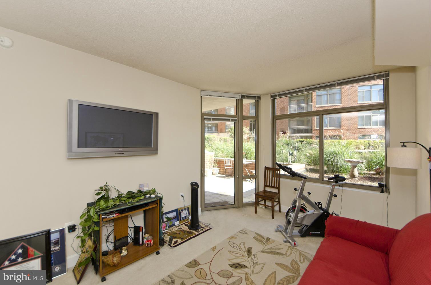 3600 South Glebe Road, Unit 235W Arlington, VA 22202 - Photo 6 of 30 a living room with furniture and a flat screen tv