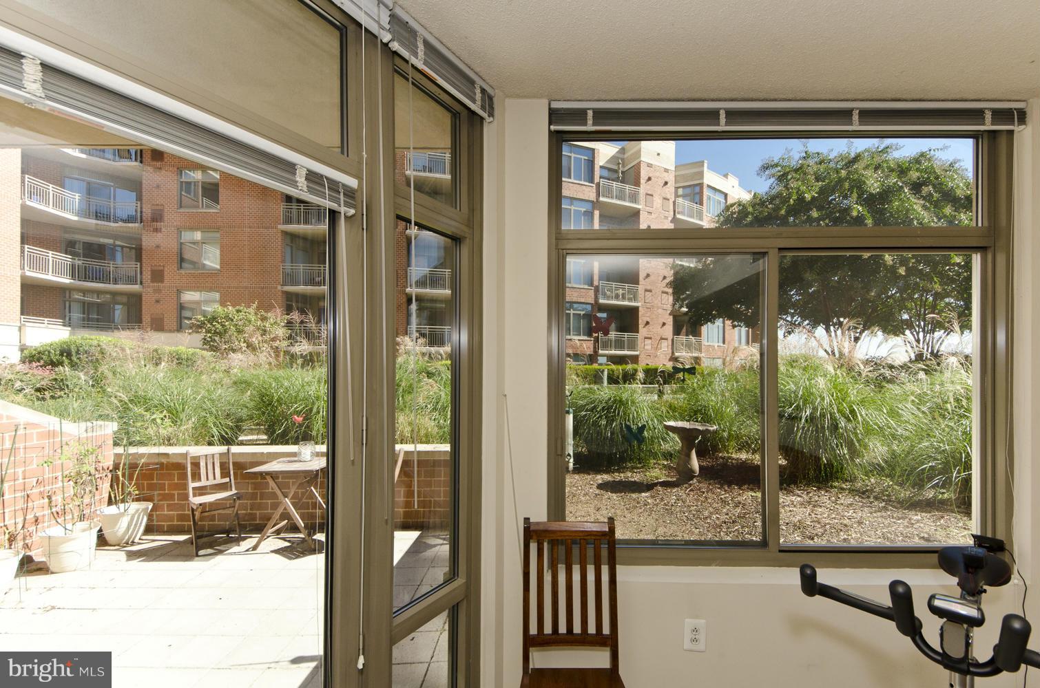 3600 South Glebe Road, Unit 235W Arlington, VA 22202 - Photo 7 of 30 a view of a room with a large window and wooden floor