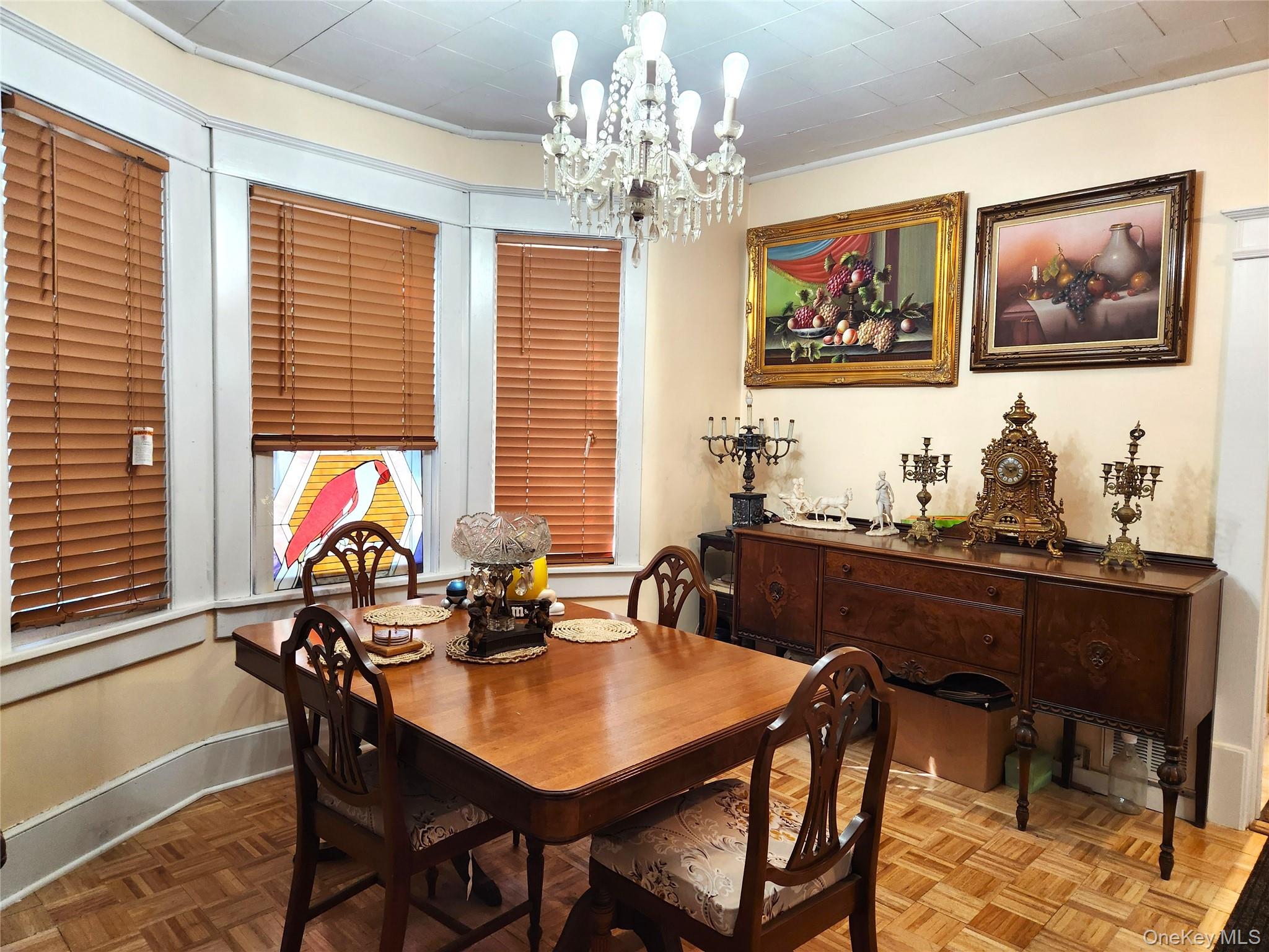 35 Youngs Hill Road Liberty, NY 12754 - Photo 12 of 32 a view of a dining room with furniture a chandelier and a window