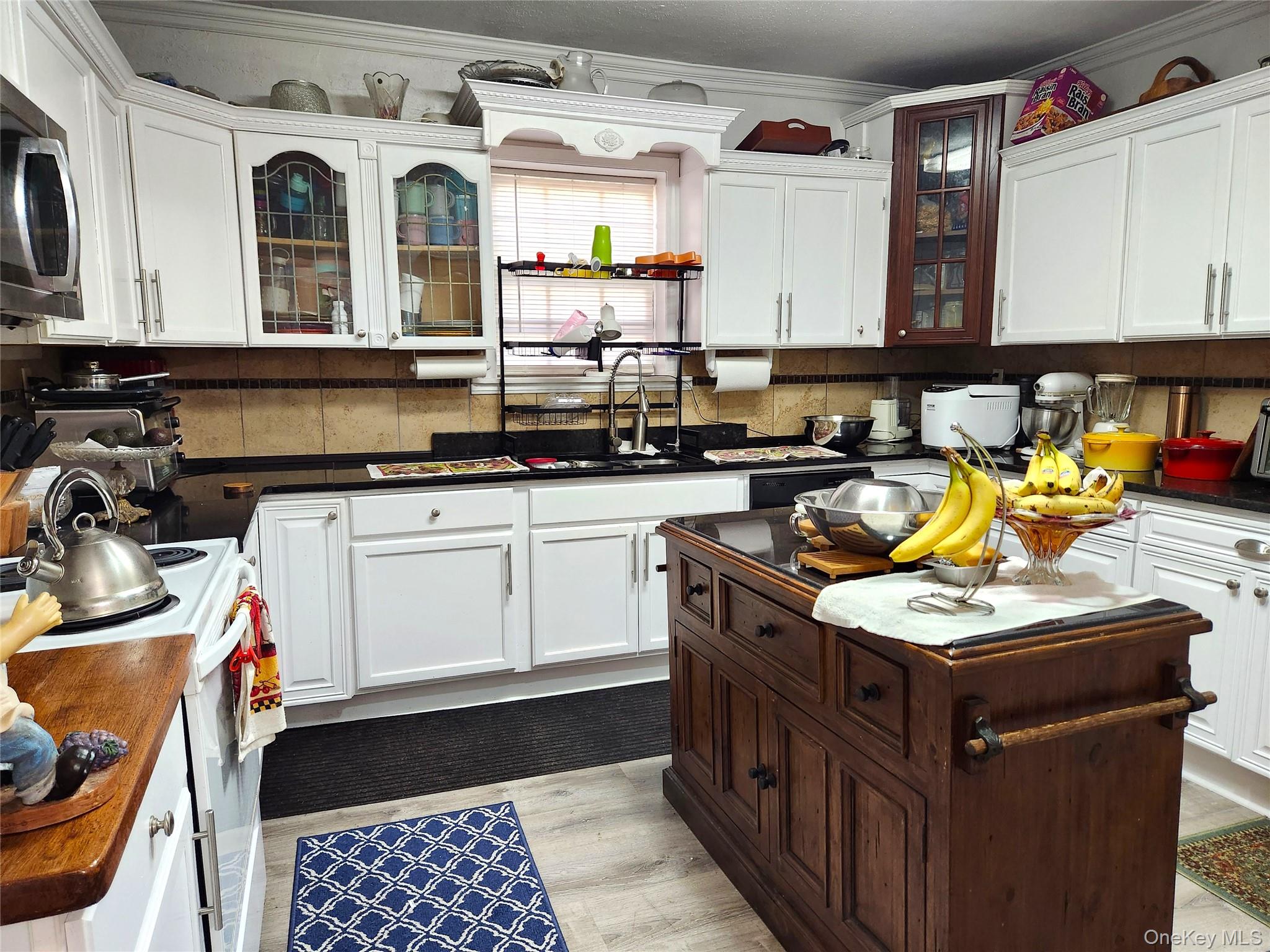 35 Youngs Hill Road Liberty, NY 12754 - Photo 14 of 32 a kitchen with stainless steel appliances granite countertop a sink and a stove