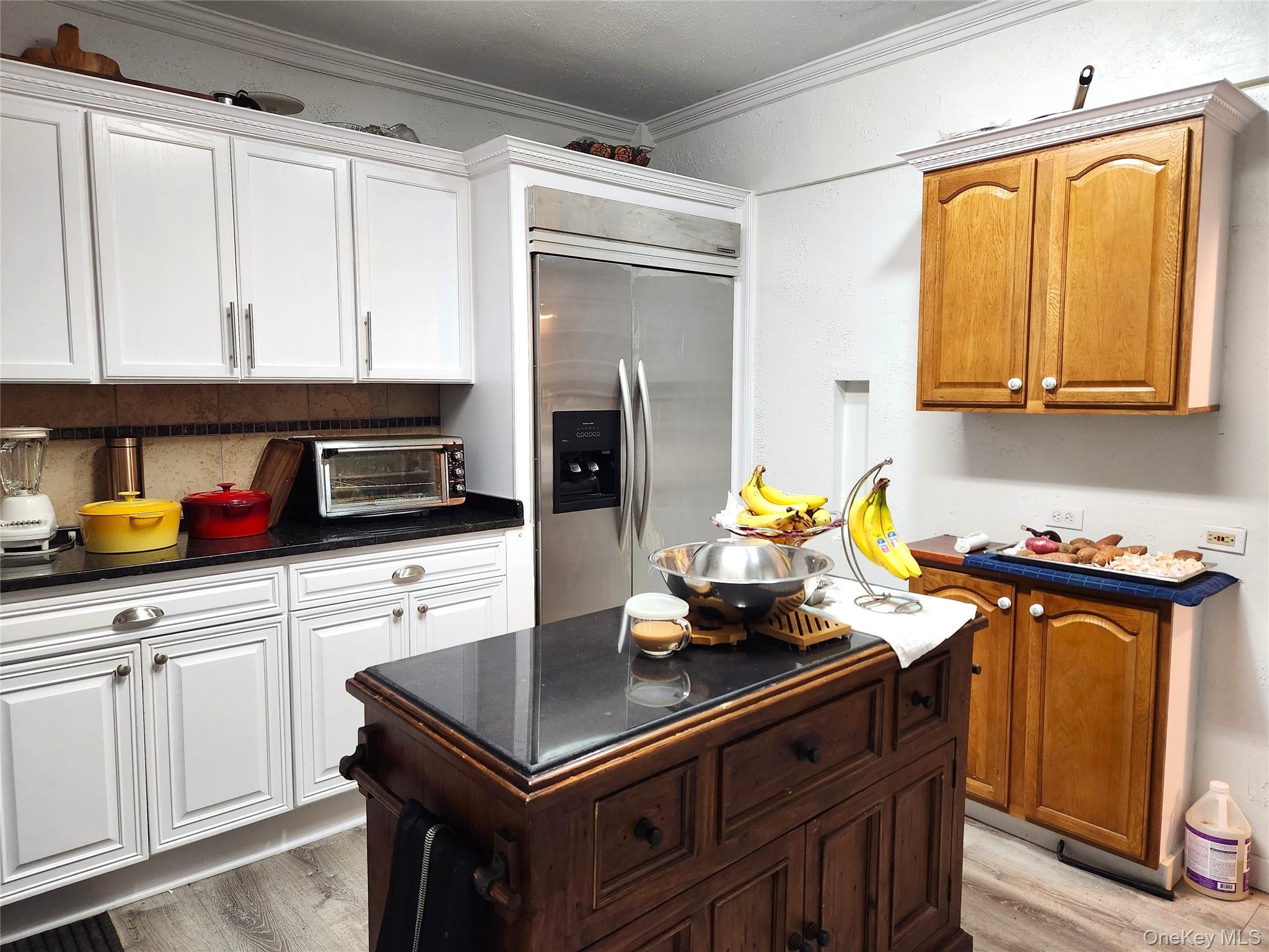 35 Youngs Hill Road Liberty, NY 12754 - Photo 16 of 32 a kitchen with a refrigerator and a stove top oven