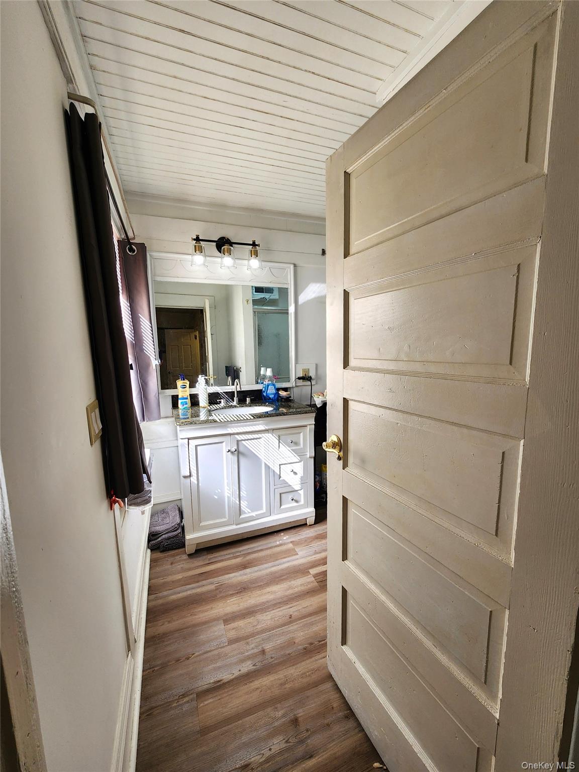 35 Youngs Hill Road Liberty, NY 12754 - Photo 22 of 32 a kitchen with a refrigerator and white cabinets