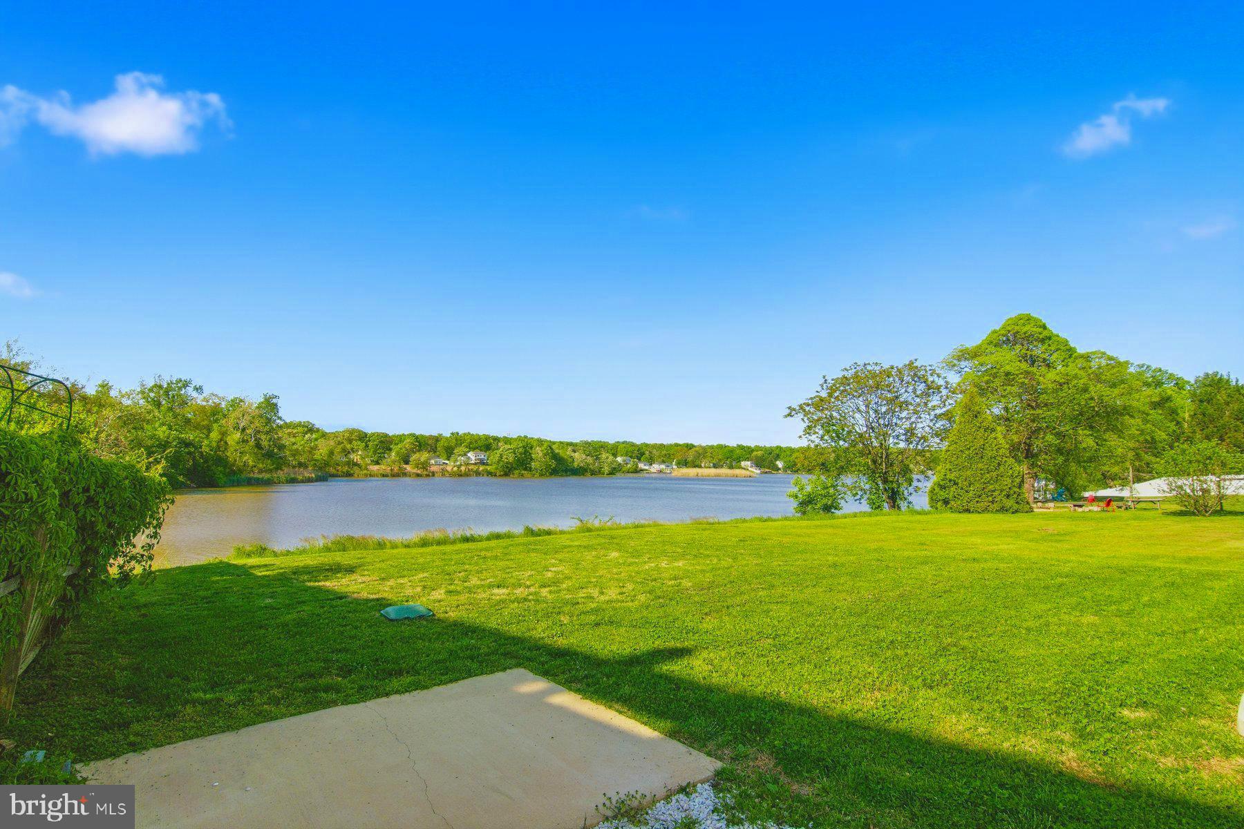 11030 Bird River Grove Road White Marsh, MD 21162 - Photo 33 of 53 a view of a lake and a yard