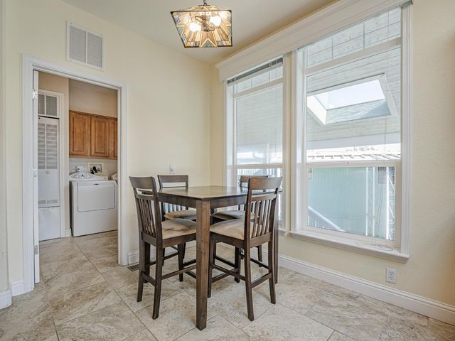 a kitchen with granite countertop sink cabinets and stainless steel appliances