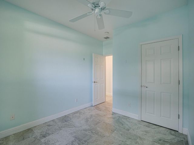 a spacious bathroom with a sink double vanity mirror and a bathtub