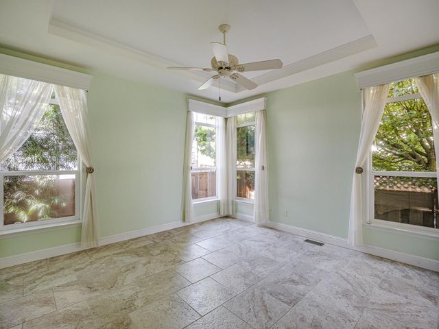 a bath tub sitting in a bathroom next to a window
