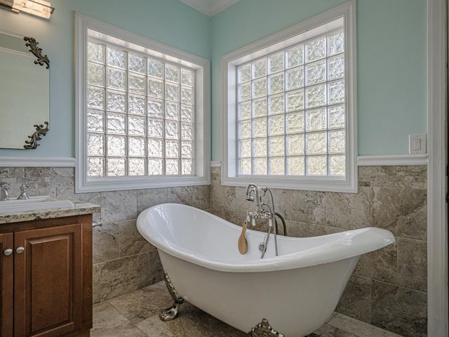 a view of a patio with a table and chairs